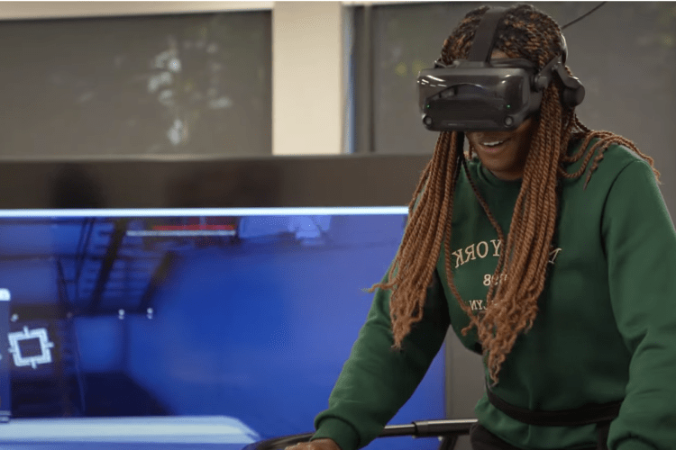 A student tries out a VR fitness game.